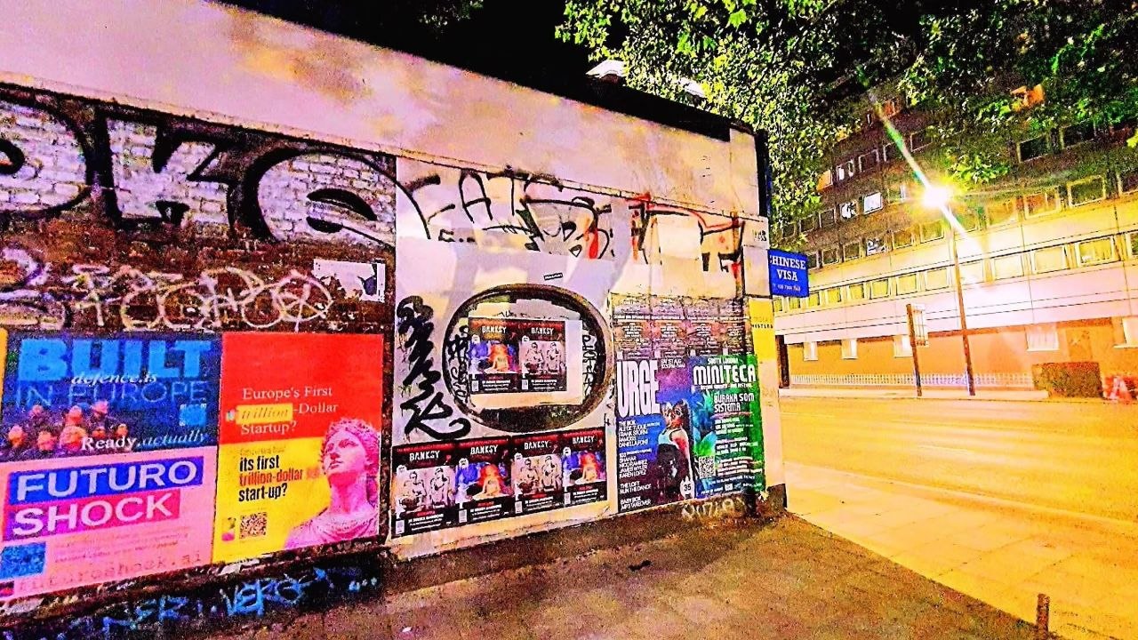 Poster pasted on a London hoarding, 13 July 2026